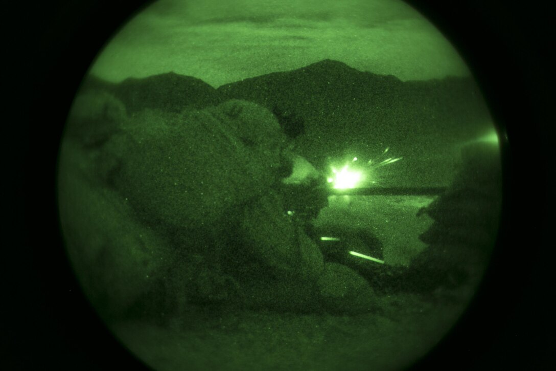 Lance Cpl. Zach Frankley and Pfc. Kervin Jean-Claude, machine gunners, 1st Battalion, 7th Marine Regiment, fire at a target at Range 400 aboard Marine Corps Air Ground Combat Center Twentynine Palms, Calif., during the unit’s night-time combined arms live-fire exercise Nov. 16, 2016. (Official Marine Corps photo by Cpl. Julio McGraw/Released)