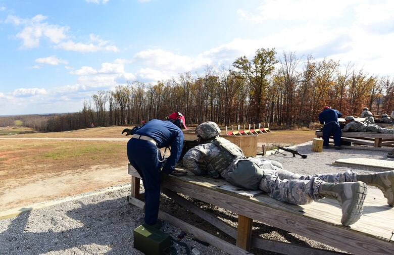 509th Security Forces Squadron (SFS) combat arms instructors coach 509th SFS security response team members while firing an M249 automatic rifle at Fort Leonard Wood, Mo., Nov. 14, 2016. The 509th SFS combat arms instructors qualify 160 Airmen on the M249 annually.