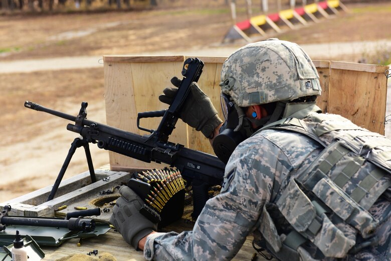 U.S. Air Force Airman 1st Class James Ballard, a 509th Security Forces Squadron (SFS) security response team member, loads 5.56 ammunition into a M249 automatic rifle at Fort Leonard Wood, Mo., Nov. 14, 2016. The 509th SFS annually qualifies on various weapons they may be required to carry while on duty or deployed depending on the protection level.