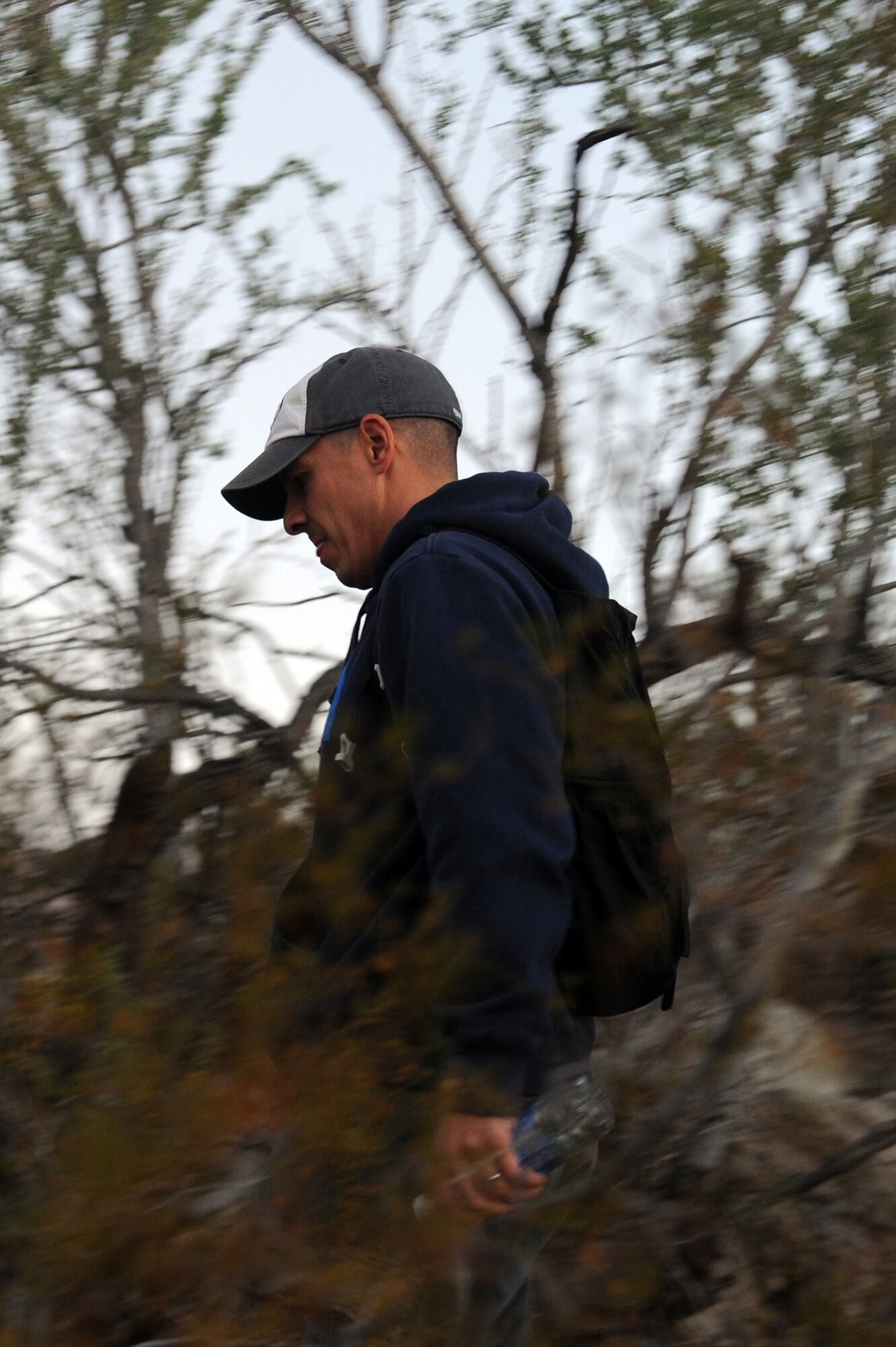 Senior Master Sgt. Mark James, 56th Maintenance Group maintenance operations flight maintenance training flight superintendent, descends the Verrado trailhead Nov. 18, 2016 at the White Tank Mountains in Surprise, Ariz. This is the first of many hikes the 56th MXG maintenance operations Airmen will participate in. (U.S. Air Force photo by Airman 1st Class Pedro Mota)