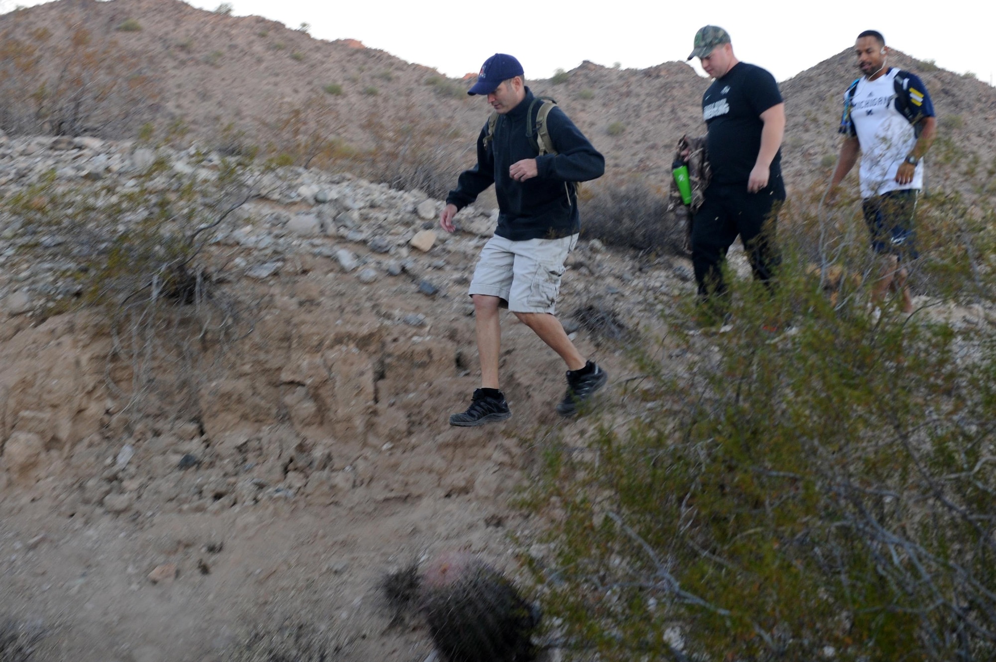 Maj. Daniel Kline, 56th Maintenance Group maintenance operations staff section commander, leads Airmen down to a riverbed Nov. 18, 2016 at the White Tank Mountains in Surprise, Ariz. The hike was about three miles. (U.S. Air Force photo by Airman 1st Class Pedro Mota)