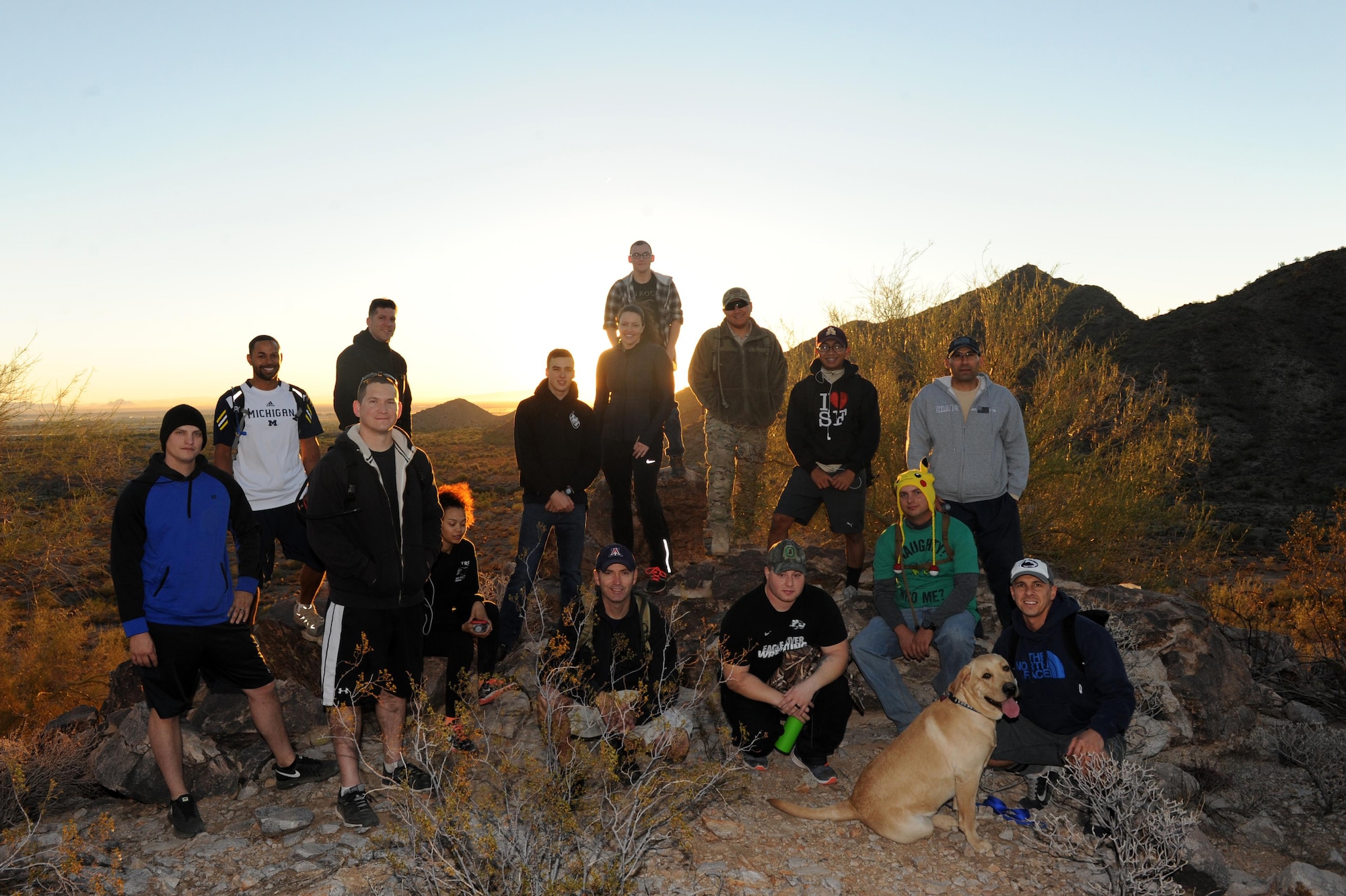 The 56th Maintenance Group maintenance operations staff rests atop the Verrado trailhead Nov. 18, 2016 at the White Tank Mountains. The hike was directed to improve morale and leadership. (U.S. Air Force photo by Airman 1st Class Pedro Mota)