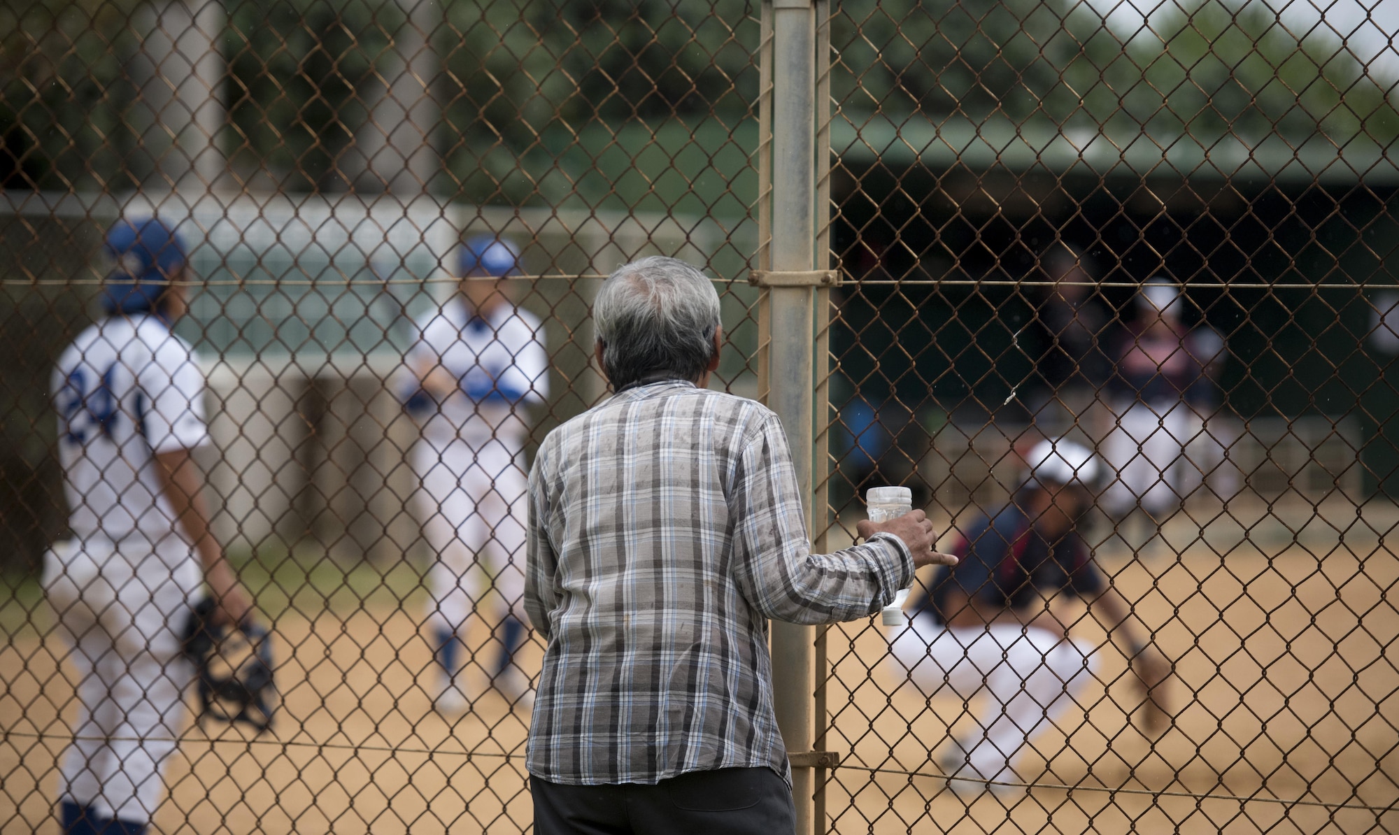 Local residents watch the U.S. Consulate Allstars versus Okinawa Prefectural Government game Nov. 19, 2016, at a baseball field in  Naha, Japan. The Allstars, a team created by the U.S. Consulate General of Naha, plan to play multiple games against other teams on Okinawa building partnerships and spreading diplomacy through the common U.S.-Japan interest of baseball. (U.S. Air Force photo by Senior Airman Omari Bernard/Released)