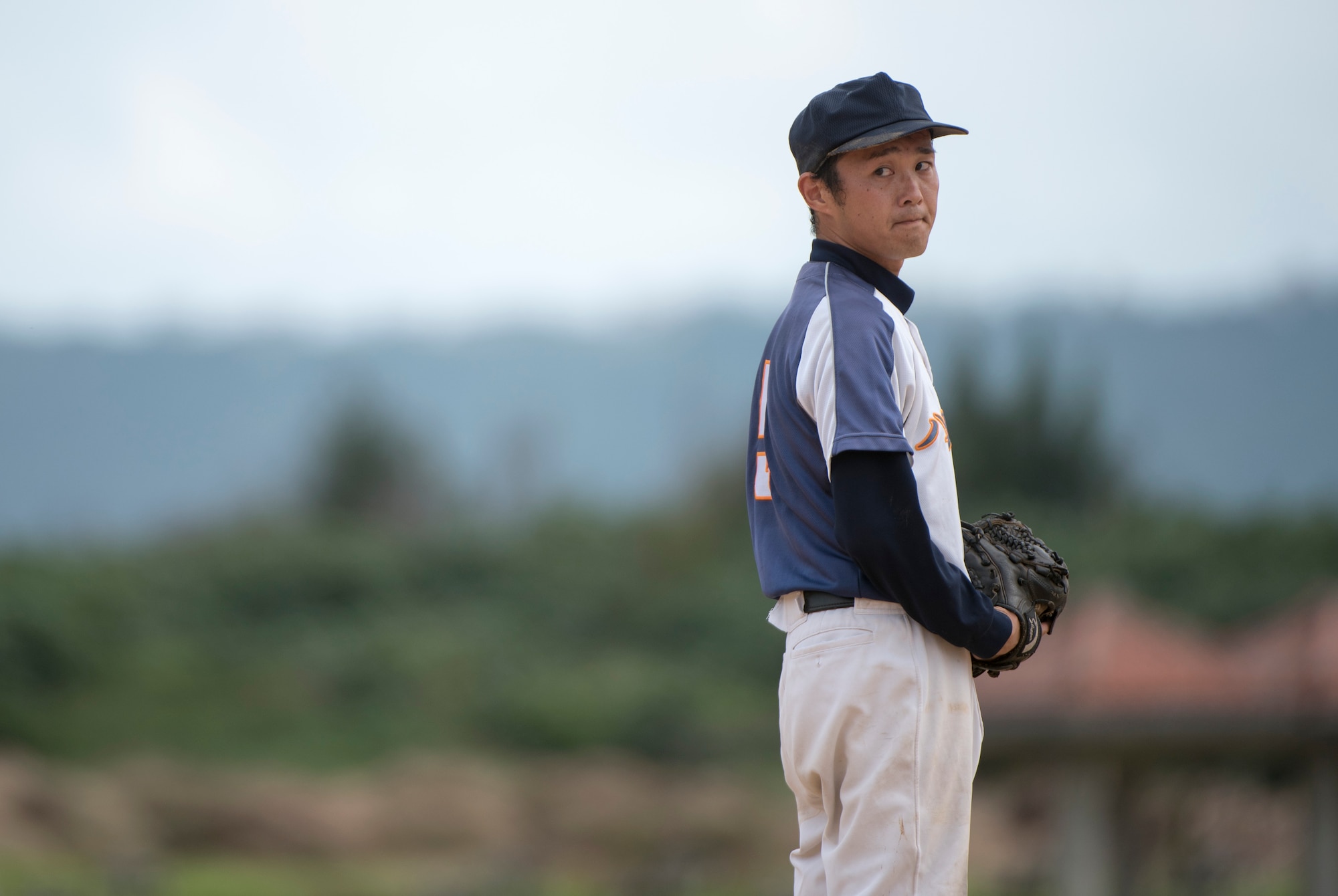 Tommy Sunny, Okinawa Prefectural Government’s baseball team pitcher, focuses before throwing a pitch during a game Nov. 19, 2016, at a baseball field in Naha, Japan. The Okinawa Prefectural Government defeated the Allstars 15-5 in a nine-inning game. (U.S. Air Force photo by Senior Airman Omari Bernard/Released)