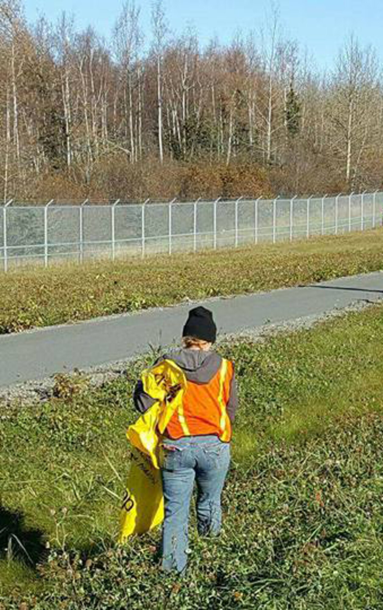 Members of the 477th Aircraft Maintenance Squadron perform clean-up on their adopted highway route in Anchorage, Alaska. 
