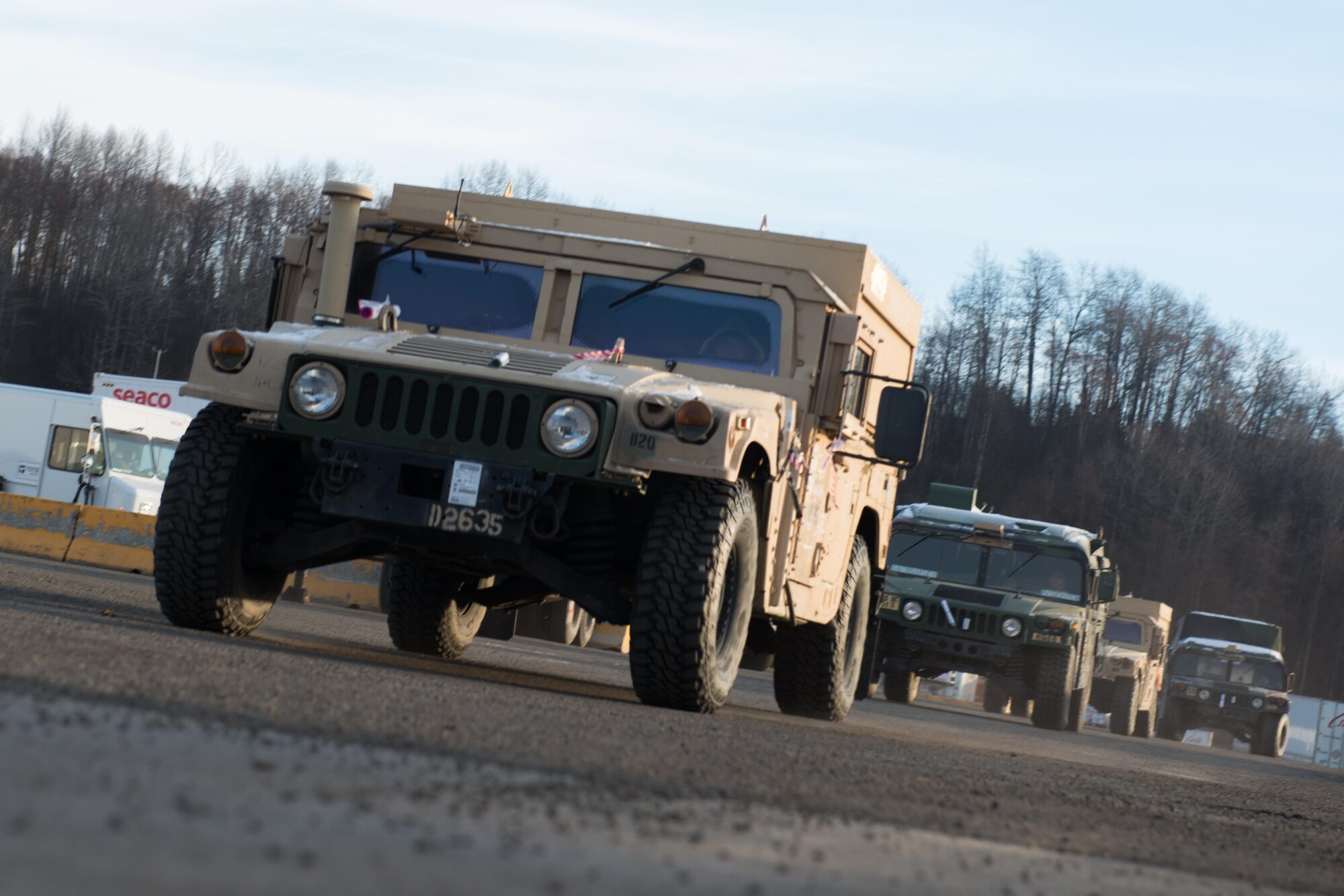 Strykers and Humvees from the 1st Stryker Brigade Combat Team, 25th Infantry Division, U.S. Army Alaska wait on a ship in the port of Anchorage, Alaska, Nov. 22. Several hundred vehicles were shipped to Fort Irwin, California on multiple vessels.