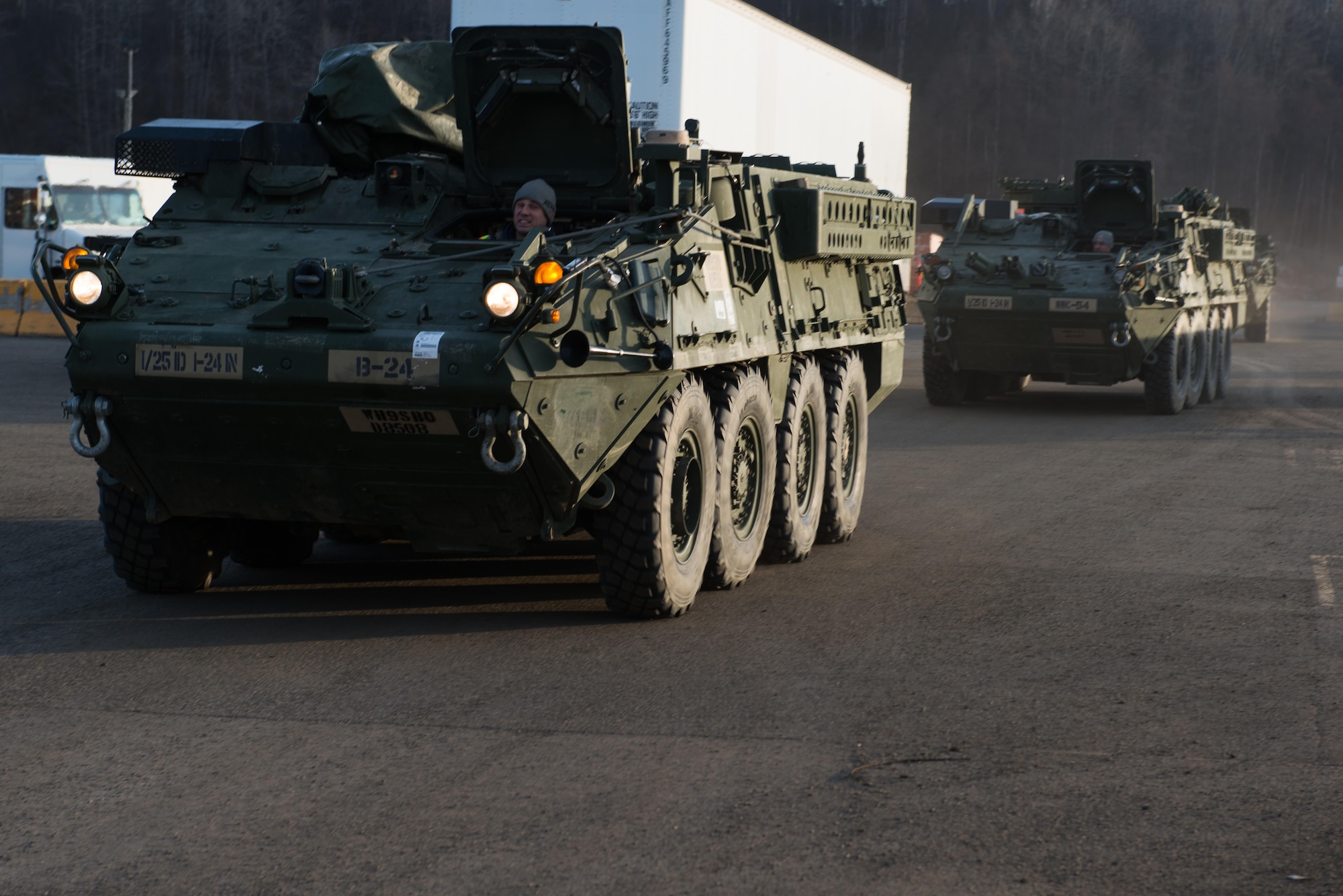 Strykers and Humvees from the 1st Stryker Brigade Combat Team, 25th Infantry Division, U.S. Army Alaska wait on a ship in the port of Anchorage, Alaska, Nov. 22. Several hundred vehicles were shipped to Fort Irwin, California on multiple vessels.
