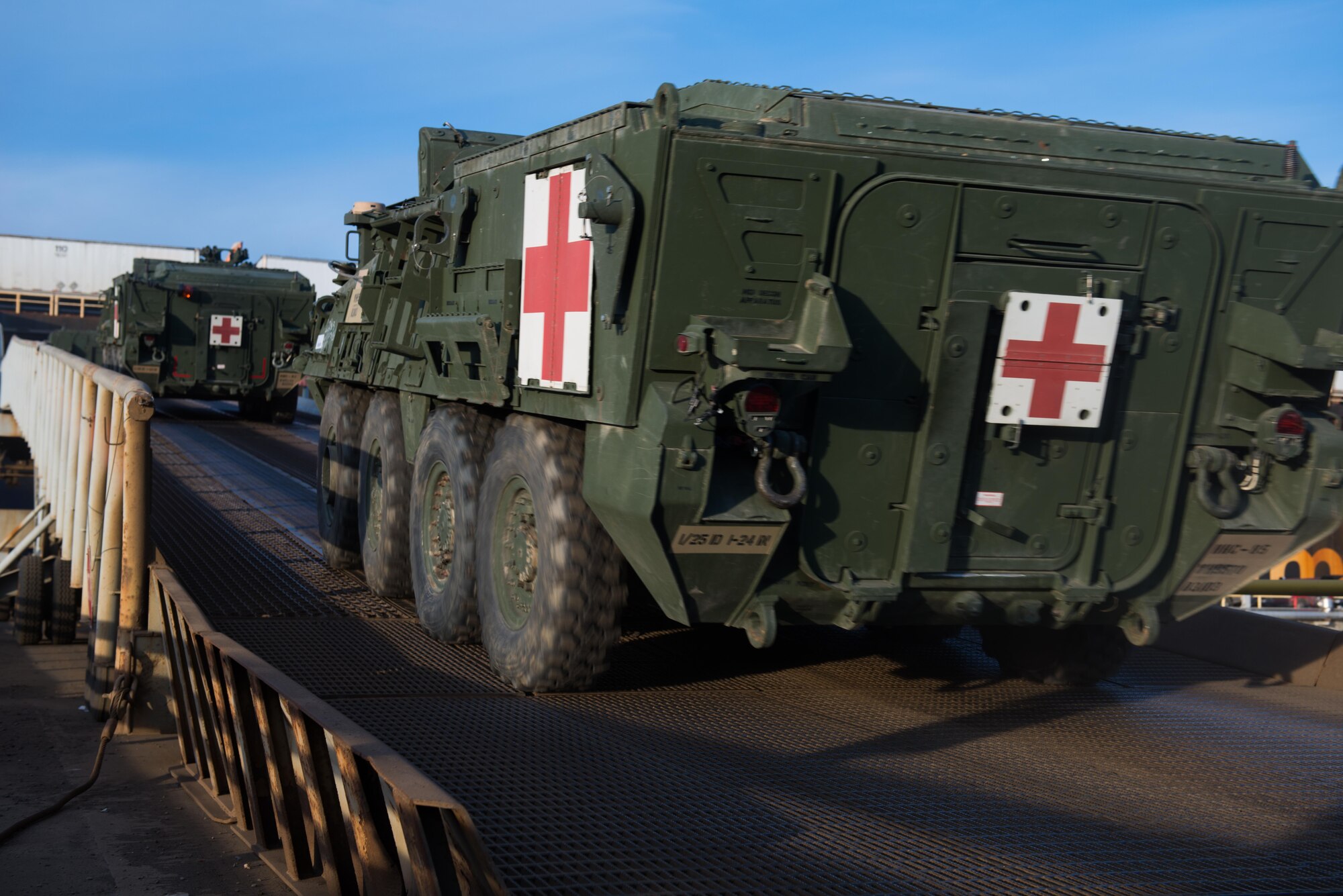 A team of Soldiers with the 2nd Battalion, 377th Parachute Field Artillery Regiment load Strykers and Humvees onto a ship in the port of Anchorage, Alaska, Nov. 22. Several hundred vehicles were shipped to Fort Irwin, California on multiple vessels.