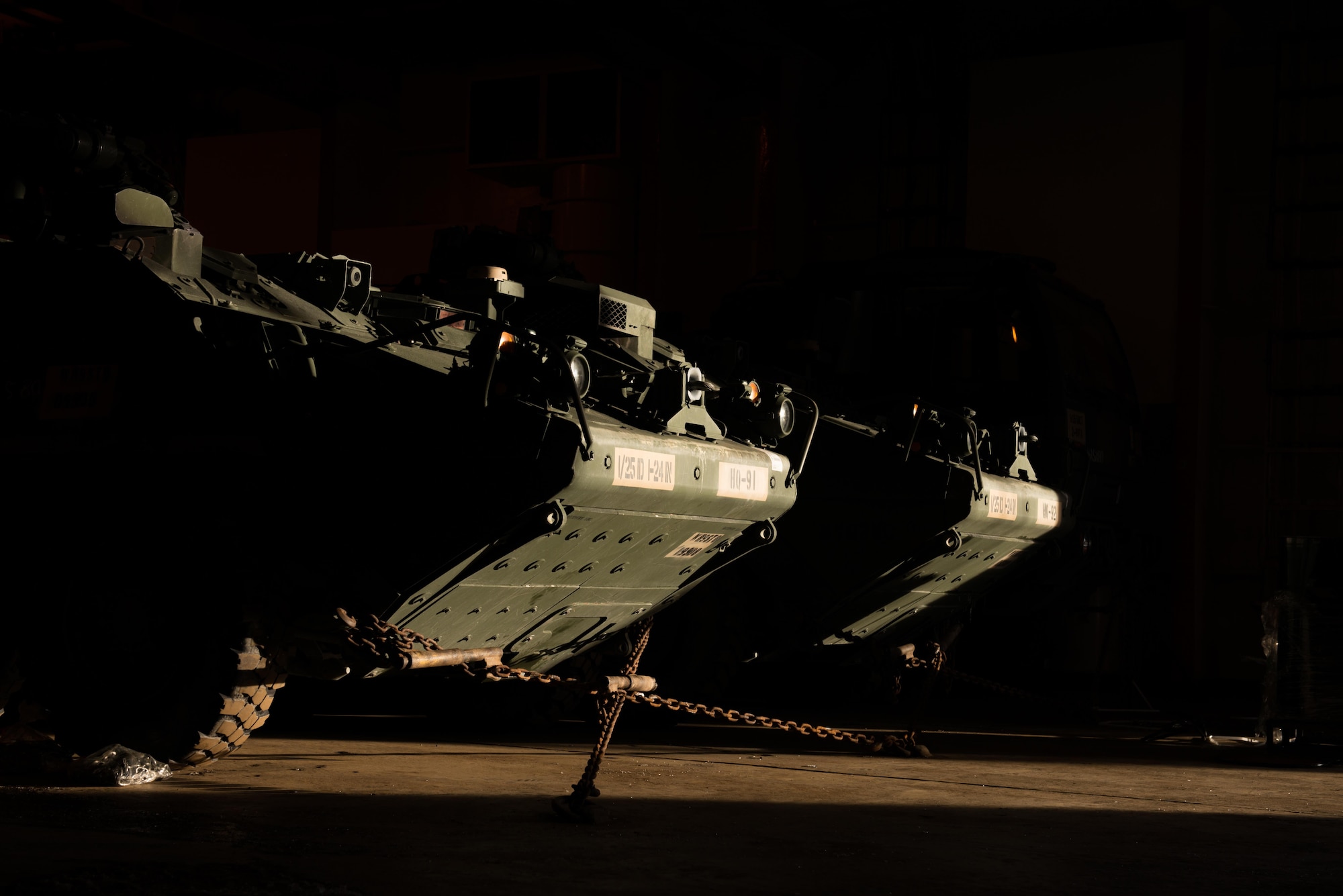 Strykers and Humvees from the 1st Stryker Brigade Combat Team, 25th Infantry Division, U.S. Army Alaska wait on a ship in the port of Anchorage, Alaska, Nov. 22. Several hundred vehicles were shipped to Fort Irwin, California on multiple vessels.