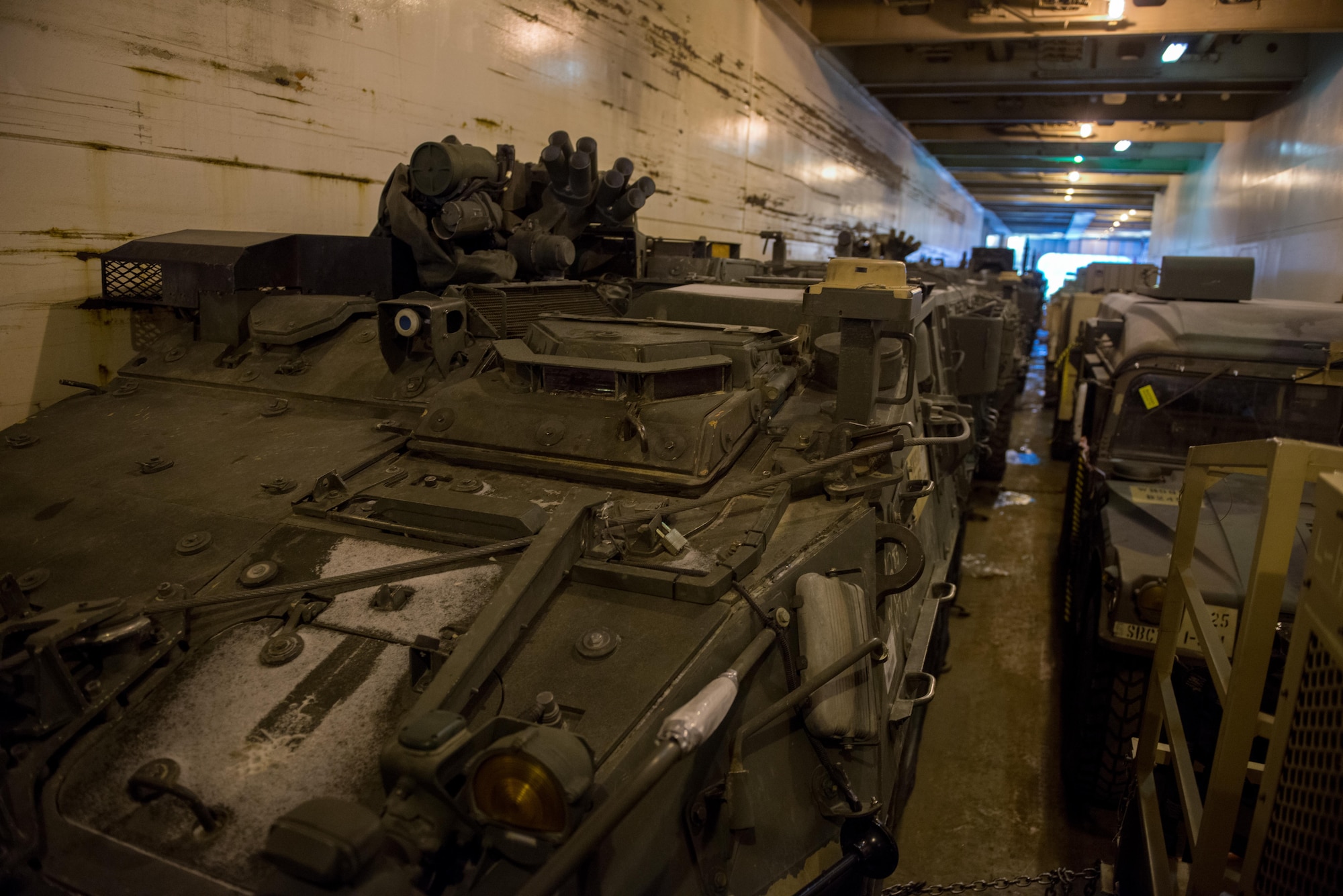 Strykers and Humvees from the 1st Stryker Brigade Combat Team, 25th Infantry Division, U.S. Army Alaska wait on a ship in the port of Anchorage, Alaska, Nov. 22. Several hundred vehicles were shipped to Fort Irwin, California on multiple vessels.