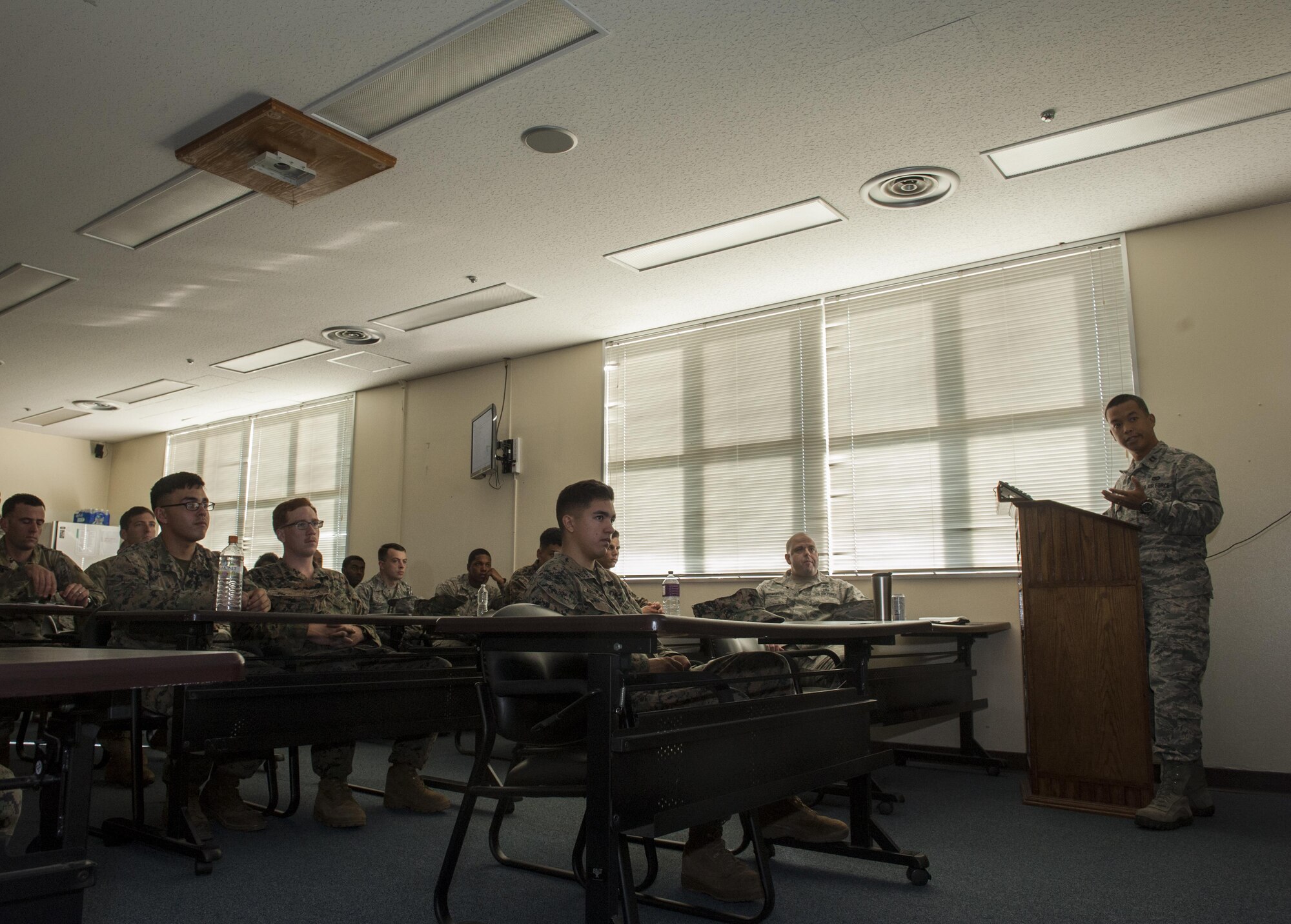 U.S. Air Force Capt. David Nguyen, 18th Civil Engineer Squadron Readiness and Emergency flight commander, presents information at the Chemical, Biological, Radiological and Nuclear (CBRN) Exposition Nov. 17, 2016, at Kadena Air Base, Japan. The CBRN Exposition is an opportunity for CBRN specialists from all branches of service to come together and discuss the future of training, readiness and equipment. (U.S. Air Force photo by Senior Airman Lynette M. Rolen/Released)