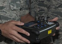 U.S. Air Force Senior Airman Gabriel Albano, 18th Aerospace Medicine Squadron bioenvironmental technician, discusses the different capabilities of a HazMatID Elite, a chemical identifier, during the Chemical, Biological, Radiological and Nuclear (CBRN) Exposition Nov. 17, 2016, at Kadena Air Base, Japan. The CBRN Exposition highlights the different equipment each branch of service utilizes. (U.S. Air Force photo by Senior Airman Lynette M. Rolen/Released)