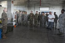U.S. Marine Corps Lance Cpl. James Dietrich, Third Marine Division Headquarters Battalion Chemical, Biological, Radiological and Nuclear platoon, talks about the different CBRN equipment Marines utilize during the CBRN Exposition Nov. 17, 2016, at Kadena Air Base, Japan. Chemical, Biological, Radiological and Nuclear specialists from across the island of Okinawa come together for the CBRN Exposition. (U.S. Air Force photo by Senior Airman Lynette M. Rolen/Released)