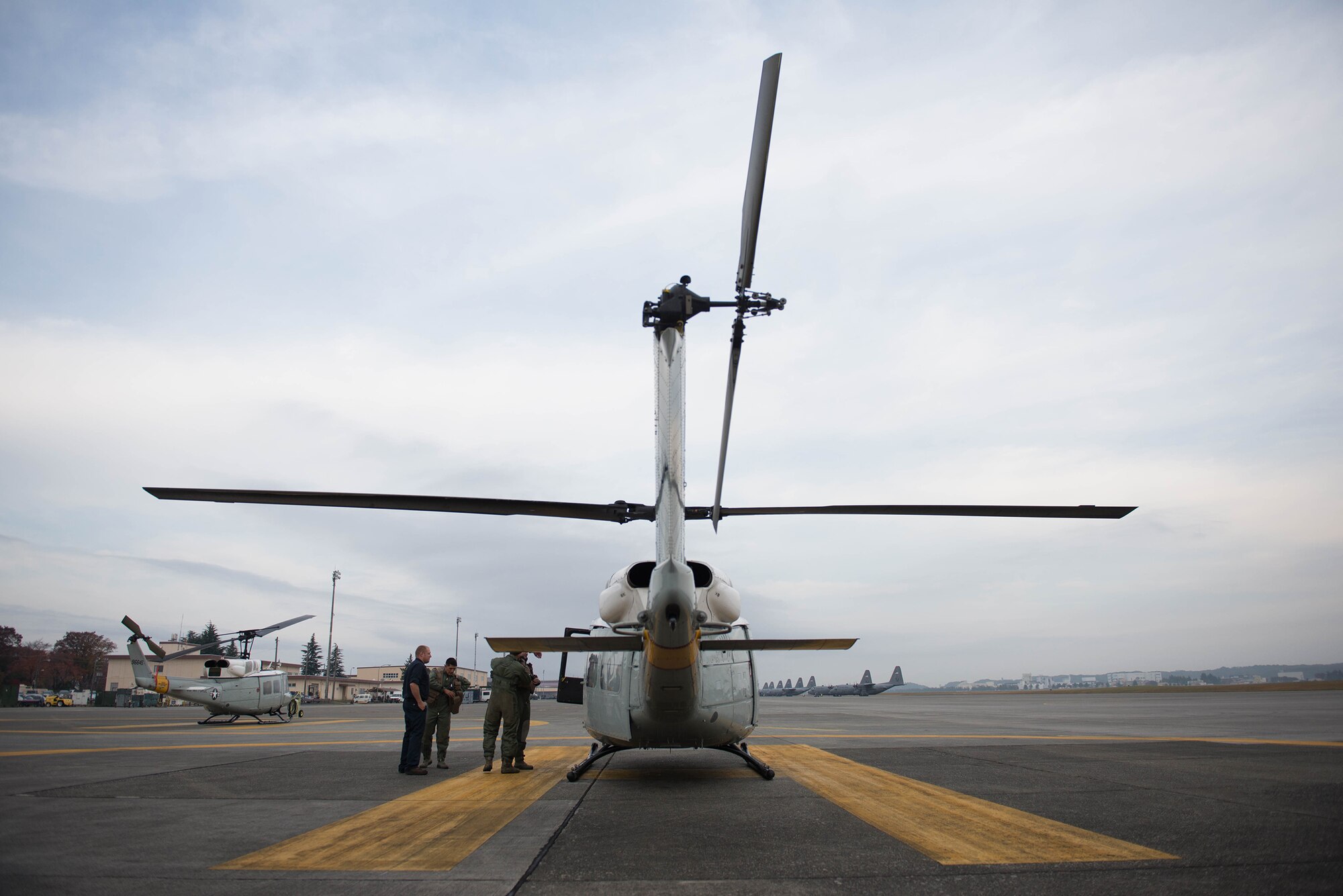 Crewmembers from the 459th Airlift Squadron prepare for a flight Nov. 21, 2016, at Yokota Air Base, Japan during a Tokyo Metropolitan Government Comprehensive Disaster Management Drill. The 459th AS worked with the Japan Self-Defense Forces, U.S. Army and U.S. Navy on an exercise delivering simulated humanitarian aid to Oshima Island, Japan, after a volcanic eruption. (U.S. Air Force  photo by Senior Airman Justin Carnahan/Released)