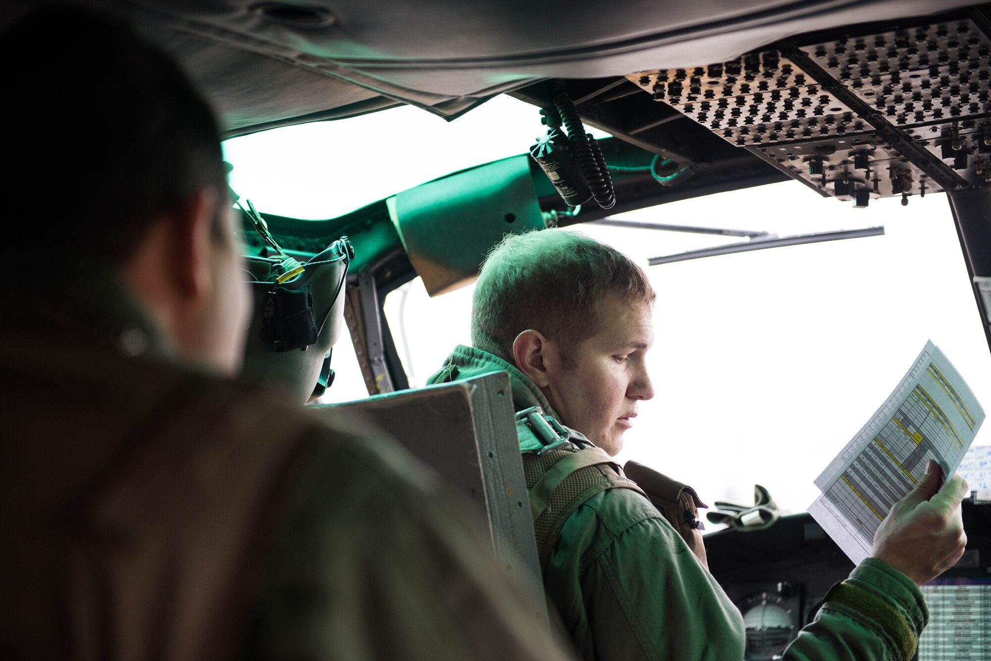 Capt. Jon Coffey, 459th Airlift Squadron UH-1N Iroquois instructor pilot, completes a preflight checklist before flight at Yokota Air Base, Japan, Nov. 21, 2016, during a Tokyo Metropolitan Government Comprehensive Disaster Management Drill. The 459 AS worked with the Japan Self-Defense Forces, U.S. Army and U.S. Navy on an exercise delivering simulated humanitarian aid to Oshima, Japan, after a volcanic eruption. (U.S. Air Force  photo by Senior Airman Justin Carnahan/Released)