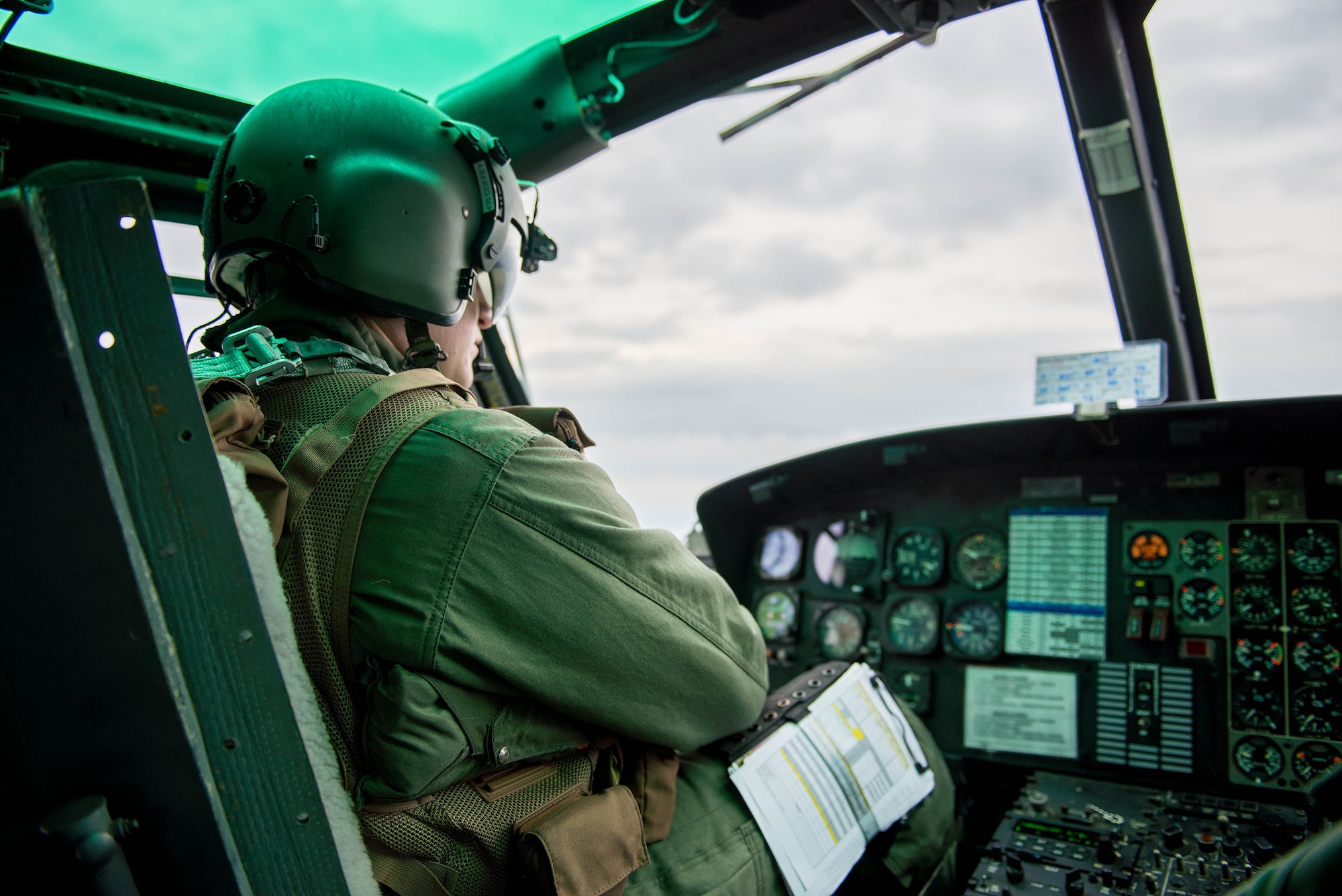 Capt. John Coffey, 459th Airlift Squadron UH-1N instructor pilot, navigates over Japan during a Tokyo Metropolitan Government Comprehensive Disaster Management Drill, Nov. 21, 2016. The 459 AS, Japan Self-Defense Forces, U.S. Army and U.S. Navy practiced delivering simulated relief supplies to Oshima Island. (U.S. Air Force  photo by Senior Airman Justin Carnahan/Released)