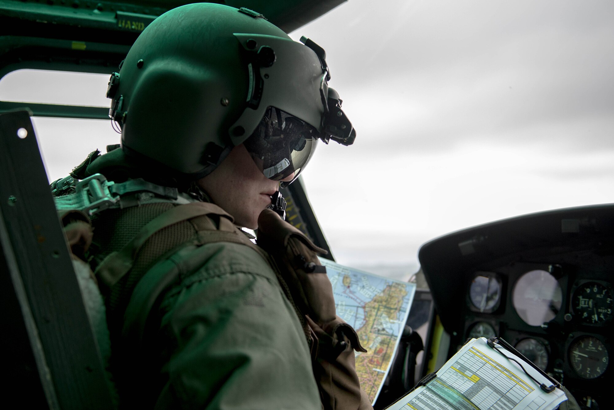 Capt. John Coffey, 459th Airlift Squadron UH-1N instructor pilot, navigates over Japan during a Tokyo Metropolitan Government Comprehensive Disaster Management Drill, Nov. 21, 2016. The 459 AS, Japan Self-Defense Forces, U.S. Army and U.S. Navy practiced delivering simulated relief supplies to Oshima Island. (U.S. Air Force  photo by Senior Airman Justin Carnahan/Released)