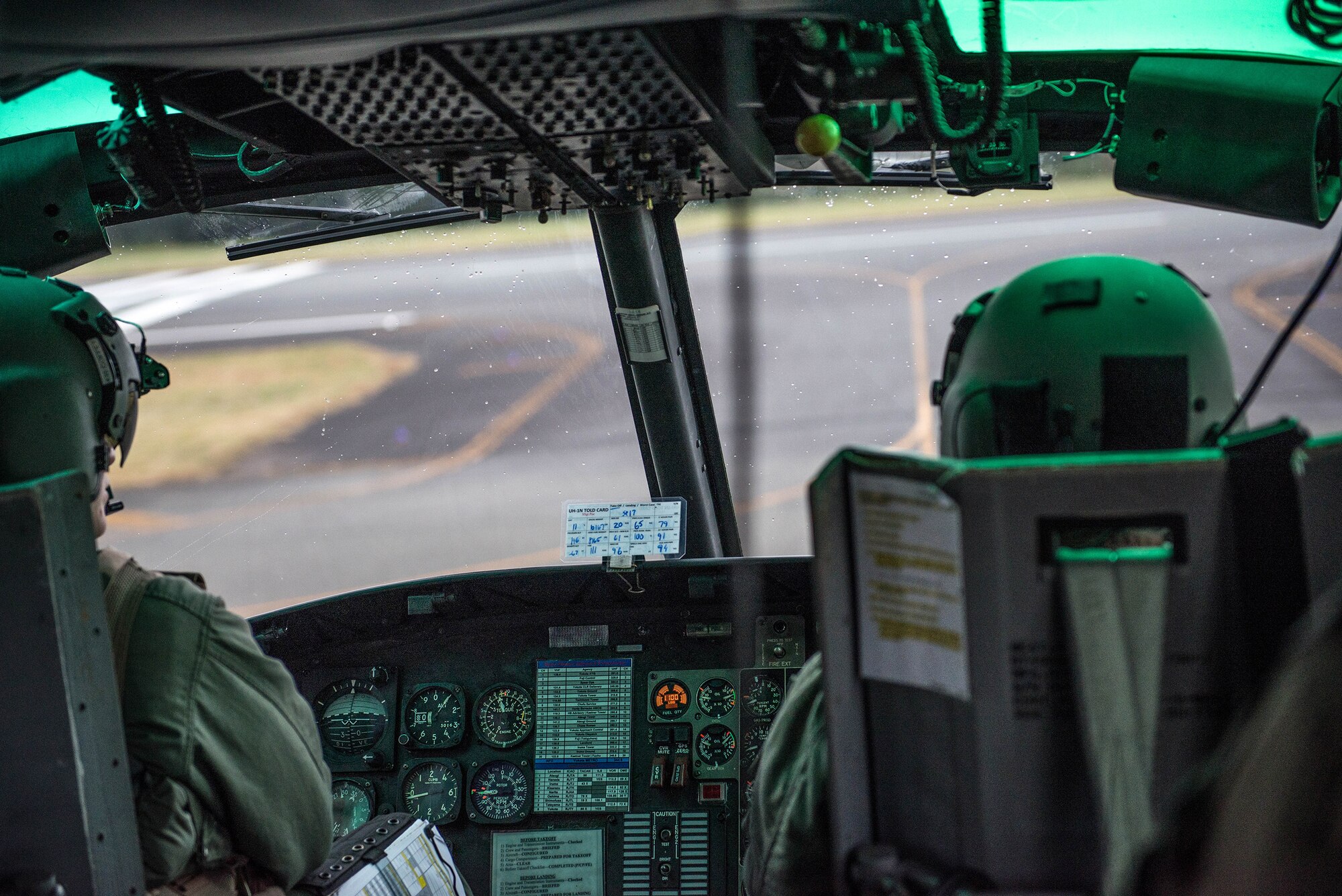 Rain falls onto the windshield of a UH-1N Iroquois as it takes off from Oshima Airport, Nov 21, 2016. Yokota's 459 Airlift Squadron, Japan Self-Defense Forces, U.S. Army and U.S. Navy practiced delivering simulated relief supplies to Oshima Island. (U.S. Air Force  photo by Senior Airman Justin Carnahan/Released)                                                     