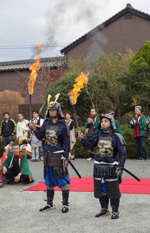 Two samurai wait to be called to light the torches at the 27th annual Kuragake Festival and Samurai Parade in Iwakuni City, Japan, Nov. 20, 2016. To commemorate the great battle of faith in 1555, Iwakuni City holds an annual festival and parade of samurai warriors. (U.S. Marine Corps photo by Sgt. Nicole Zurbrugg)  