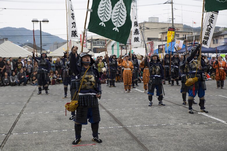 Samurai warriors yell out in encouragement during the 27th annual Kuragake Festival and Samurai Parade in Iwakuni City, Japan, Nov. 20, 2016. The warriors motivated their lord to call a battle to death. Marines from Marine Corps Air Station Iwakuni were invited to join in the historic parade, donning traditional samurai armor, swords, spears and helmets, and marching alongside local Japanese. (U.S. Marine Corps photo by Sgt. Nicole Zurbrugg) 