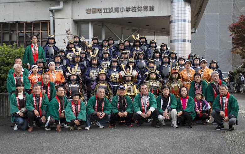Participants of the 27th annual Kuragake Festival and Samurai Parade pose for a picture in Iwakuni City, Japan, Nov. 20, 2016. Marines from Marine Corps Air Station Iwakuni were invited to partake in the historic parade, dressing up as traditional samurai. The service members marched alongside local Japanese to commemorate the great stand against an unfaithful ally. (U.S. Marine Corps photo by Sgt. Nicole Zurbrugg)