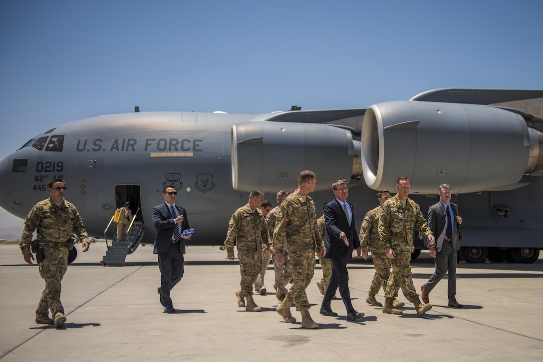 Defense Secretary Ash Carter walks with leaders at Bagram Airfield, Afghanistan, July 12, 2016. Carter discussed the U.S. role in performing both counterterrorism operations and training, advising, and assisting Afghan military forces. Air Force photo by Senior Airman Justyn M. Freeman