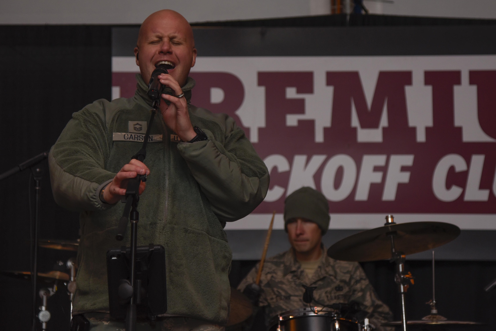 Senior Master Sgt. Ryan Carson, U.S. Air Force Band Max Impact superintendent and vocalist, hits a high note at the FedEx Field in Landover, Md., Nov. 20, 2016. The band played before the Washington Reskins military appreciation game. (U.S. Air Force photo by Airman 1st Class Valentina Lopez)