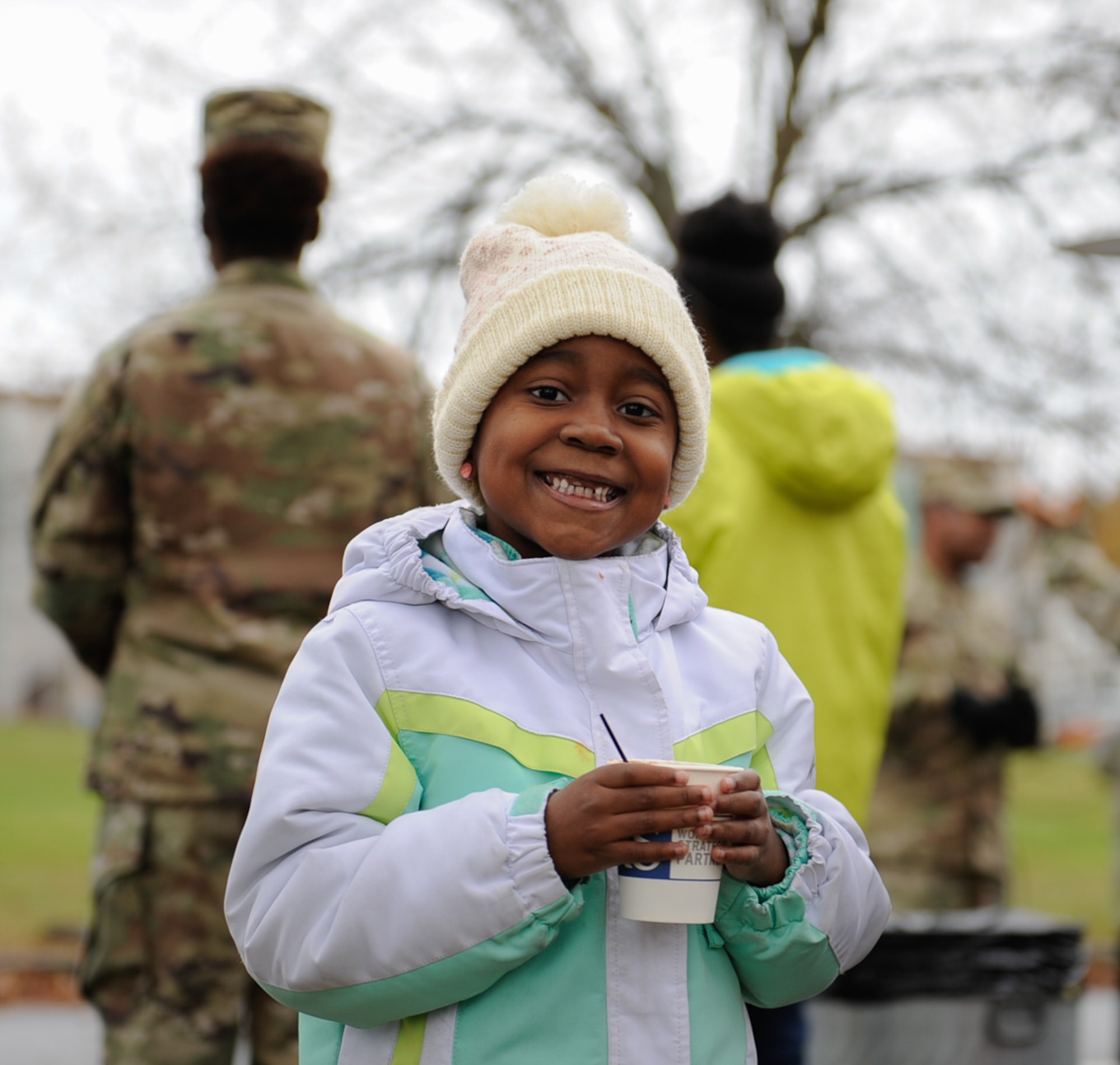Kimora Richie, daughter of U.S. Army Sergeant Keith Richie, Kleber Kaserne laboratory NCO in charge, warms herself up with hot chocolate at the Thanks for Thanksgiving event at Vogelweh Air Base. Germany, Nov. 19, 2016. More than 660 joint families were supported during this year’s Thanks for Thanksgiving event. (U.S. Air Force photo by Airman 1st Class Savannah L. Waters)

