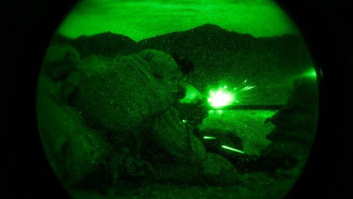 Lance Cpl. Zach Frankley and Pfc. Kervin Jean-Claude, machine gunners, 1st Battalion, 7th Marine Regiment, fire at a target at Range 400 at Marine Corps Air Ground Combat Center Twentynine Palms, California, during the unit’s night-time combined arms live-fire exercise Nov. 16, 2016. 