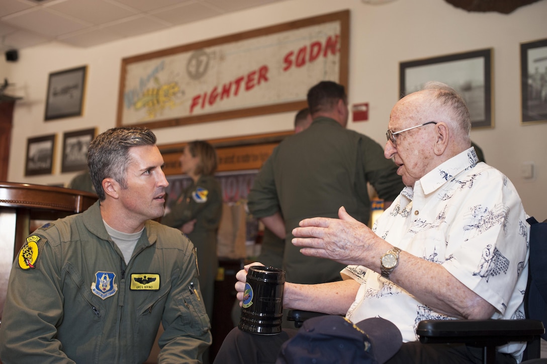 Lauren Bruner, survivor of the Dec. 7, 1941 Japanese attacks on Pearl Harbor, Hawaii, speaks with Air Force Lt. Col. Greg Krino, 47th Fighter Squadron A-10 pilot, at Davis-Monthan Air Force Base, Ariz., Sept. 16, 2016. The 47th FS was originally the 47th Pursuit Squadron assigned to Wheeler Field, Hawaii, which was credited with shooting down eight Japanese aircraft in defense of Pearl Harbor. Air Force photo by Senior Airman Chris Drzazgowski