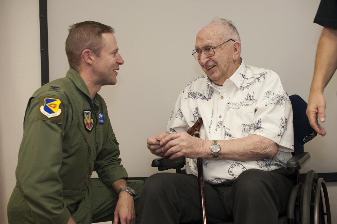 Air Force Col. Scott Campbell, 355th Fighter Wing commander, left, speaks with Lauren Bruner, survivor of the Dec. 7, 1941 Japanese attacks on Pearl Harbor, Hawaii, in the 47th Fighter Squadron at Davis-Monthan Air Force Base, Ariz., Sept. 16, 2016. The 47th FS was originally the 47th Pursuit Squadron assigned to Wheeler Field, Hawaii, which was credited with shooting down eight Japanese aircraft in defense of Pearl Harbor. Air Force photo by Senior Airman Chris Drzazgowski