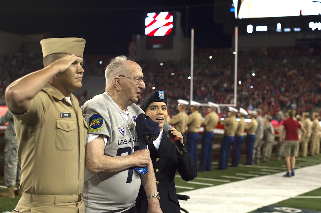 Lauren Bruner, survivor of the Dec. 7, 1941 Japanese attacks on Pearl Harbor, Hawaii, stands during a performance of the National Anthem at Arizona Stadium in Tucson, Sept. 17, 2016. Bruner was honored throughout the Arizona Wildcats versus Hawaii Rainbow Warriors football game. Air Force photo by Senior Airman Chris Drzazgowski