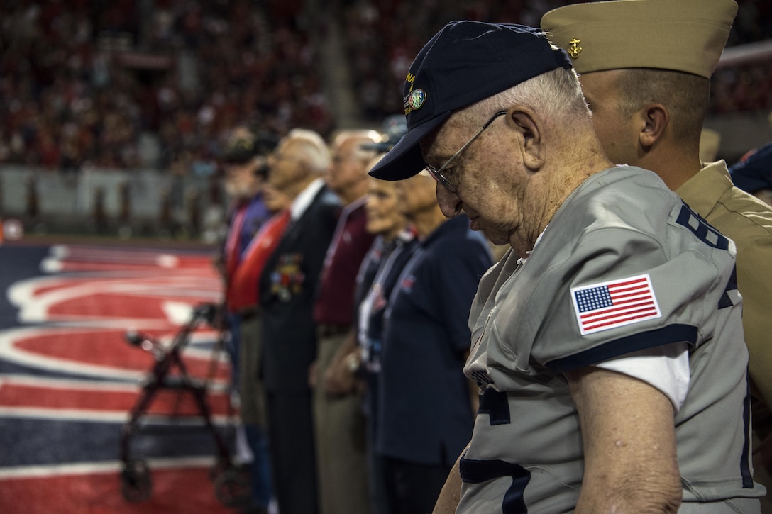 Lauren Bruner, one of six living survivors of the Dec. 7, 1941 Japanese attack on the battleship USS Arizona at Pearl Harbor, Hawaii, bows his head while being honored with other veterans at Arizona Stadium in Tucson, Sept. 17, 2016. Bruner was honored throughout the Arizona Wildcats versus Hawaii Rainbow Warriors football game commemorating the 75th anniversary of the Pearl Harbor attacks. Air Force photo by Senior Airman Chris Drzazgowski