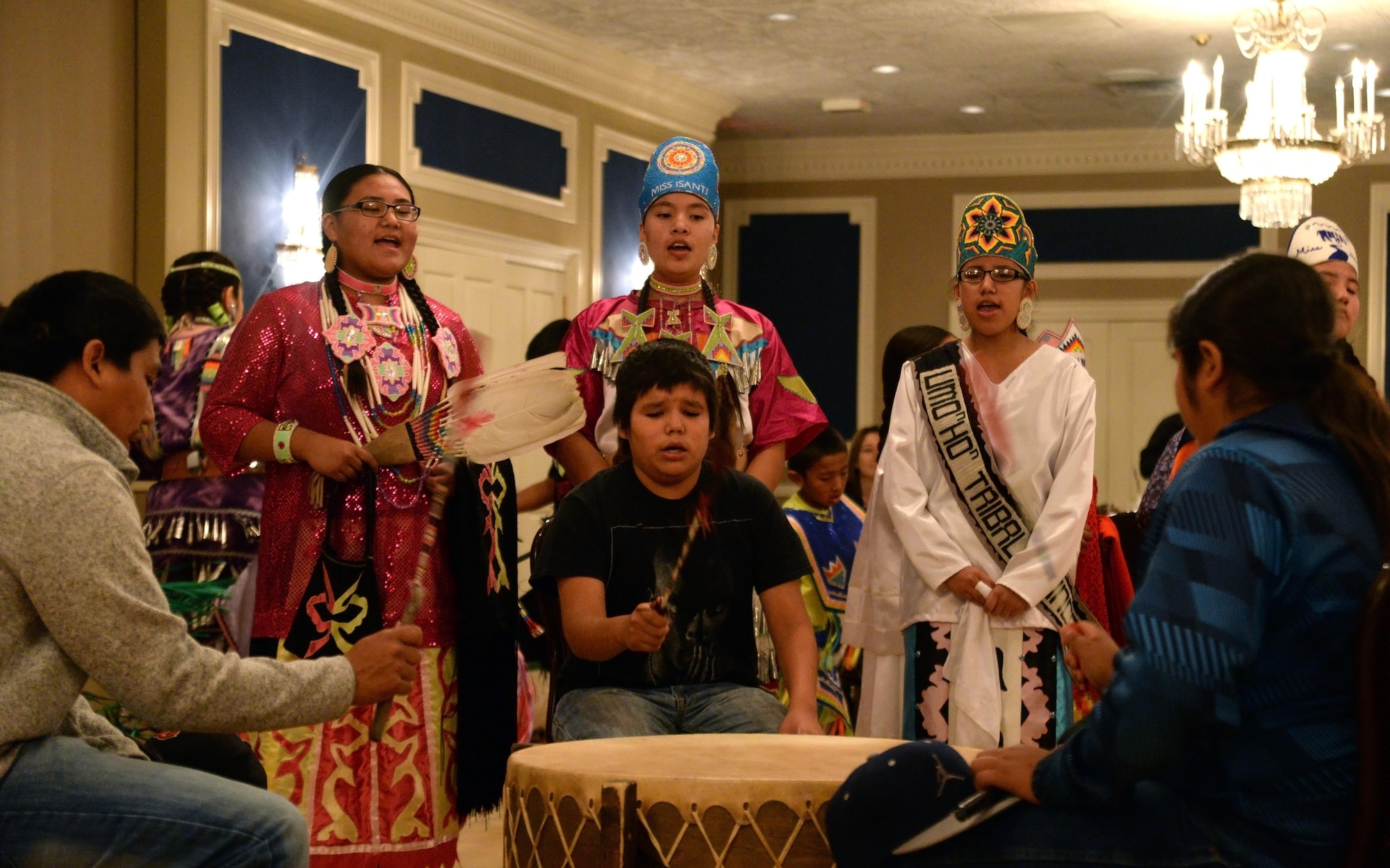 Members of the Omaha Tribe sing and play drum during the Offutt Diversity Team’s National American Indian Heritage Month Nov. 15 at the Patriot Club. The tribe performed more than 30 minutes of song and dance for members of Team Offutt. (U.S. Air Force photo/Josh Plueger)