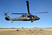 UH-60 Blackhawk Helicopter transports joint training forces to the training range at Fort Carson, Colorado, Wednesday, Nov. 9, 2016. 13th Air Support Squadron and 3rd Space Operations Squadron members take aim after the Blackhawk delivered them to the training location. (U.S. Air Force photo/Dennis Rogers)