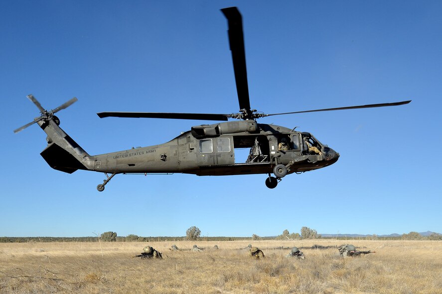 UH-60 Blackhawk Helicopter transports joint training forces to the training range at Fort Carson, Colorado, Wednesday, Nov. 9, 2016. 13th Air Support Squadron and 3rd Space Operations Squadron members take aim after the Blackhawk delivered them to the training location. (U.S. Air Force photo/Dennis Rogers)