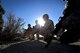 Tech. Sgt. Andy Moore (left), 13th Air Support Operations Squadron Joint Terminal Attack Controller, and the 3rd Space Operations Squadron chalk leader, waits with 3 SOPS members for their exercise to begin at Fort Carson, Colorado, Wednesday, Nov. 9, 2016.  The 3 SOPS team received a brief detailing the importance of the impending practice mission.  (U.S. Air Force photo/Dennis Rogers)