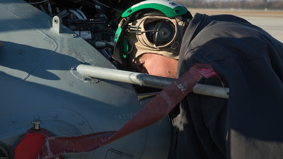 Kurt Vollweiler inspects a UH-1Y Venom during a tactical aircraft protection system assessment at Marine Corps Air Station New River, N.C., Nov. 17, 2016. Marine Medium Tilitrotor Squadron 365 (Reinforced) conducted the assessment to prepare for their upcoming deployment with the 24th Marine Expeditionary Unit. Vollweiler is the local Naval Air Technical Data and Engineering Service Center representative. 