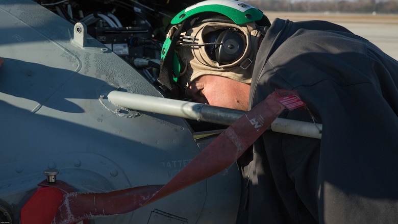 Kurt Vollweiler inspects a UH-1Y Venom during a tactical aircraft protection system assessment at Marine Corps Air Station New River, N.C., Nov. 17, 2016. Marine Medium Tilitrotor Squadron 365 (Reinforced) conducted the assessment to prepare for their upcoming deployment with the 24th Marine Expeditionary Unit. Vollweiler is the local Naval Air Technical Data and Engineering Service Center representative. 