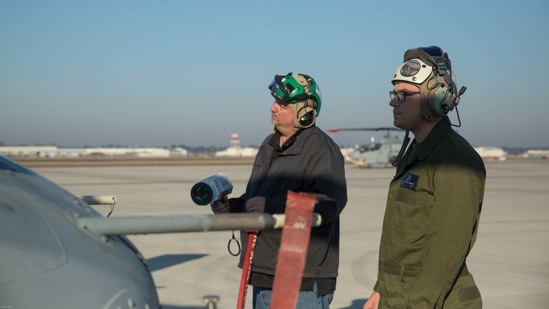 Sergeant Stephen Wilson works with Kurt Vollweiler to assess the onboard systems and tactical aircraft protection system on a UH-1Y Venom at Marine Corps Air Station New River,  N.C., Nov. 17, 2016. Marine Medium Tilitrotor Squadron 365 (Reinforced) conducted the assessment to prepare for their upcoming deployment with the 24th Marine Expeditionary Unit. Wilson serves as an aircraft avionics technician with the unit and Vollweiler serves as the Naval Air Technical Data and Engineering Service Center representative. 