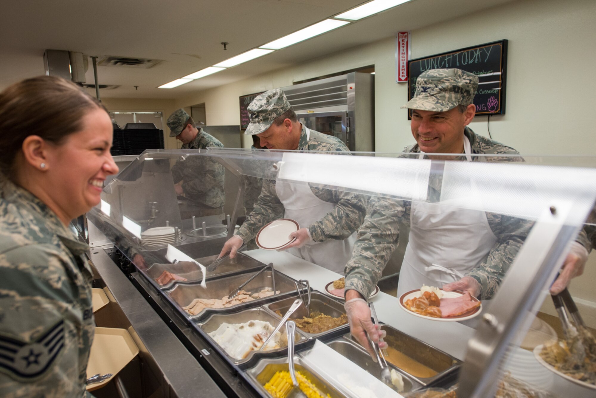Col. Tony Polashek, 934th Airlift Wing commander, serves Thanksgiving meals to airmen at the Dining Facility during the November UTA. (U.S. Air Force photo by Tech. Sgt. Trevor Saylor)