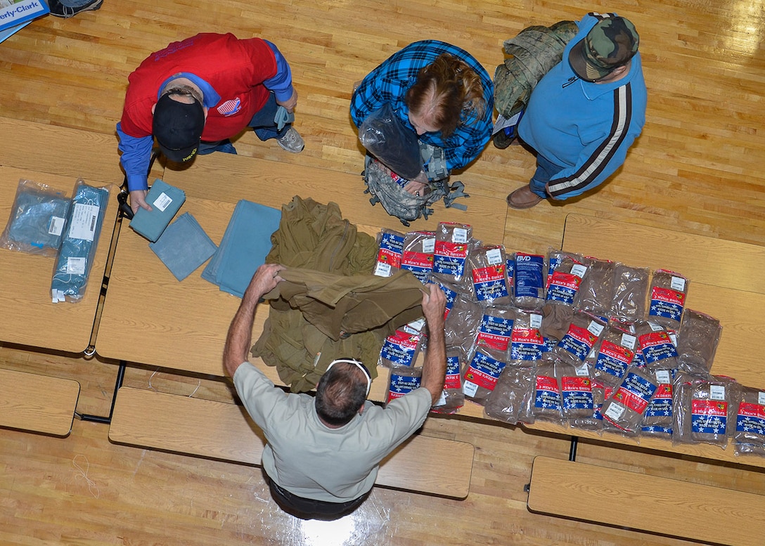 John Lanko a veteran who served as an Army medic offers excess tee shirts from DLA Disposition Services to homeless veterans in Battle Creek, Michigan. Photo by Jeff Landenberger