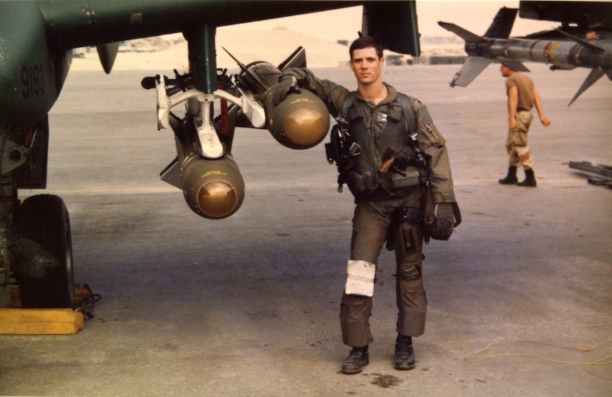 U.S. Air Force 1st Lt. John Marks poses with AGM-65 Maverick Missiles on the flightline at King Fahd Air Base, Saudi Arabia, during Desert Storm in 1991. During Desert Storm, Marks was assigned to the 76th Tactical Fighter Squadron from England Air Force Base, Louisiana. (Courtesy photo provide by Lt. Col. Marks)
