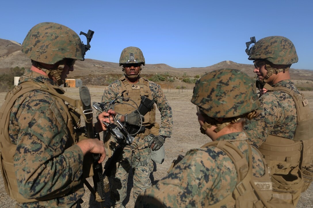 U.S. Marine Sgt. Anthony Bouquet leads his fire team in urban breaching training at Camp Pendleton, Calif., Nov. 17, 2016. Sgt. Bouquet is a combat engineer with Bravo Company, 7th Engineer Support Battalion, 1st Marine Logistics Group. The Marines with 7th ESB were put into fire teams and tasked to build explosive devices such as a hinge charge, water charge and body charge to forcefully open a locked door. (U.S. Marine Corps Photo by Lance Cpl. Joseph Sorci)