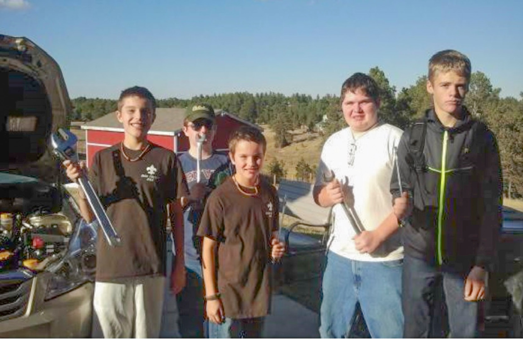 Boy Scouts from Peyton, Colorado, Troop 444 show off some of the tools they have acquired from DLA Disposition Services at Fort Carson. The troop uses the items from the Defense Logistics Agency to earn merit badges and to "be prepared" for what ever comes their way. Photo by Troop 444
