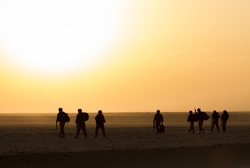 Soldiers with the 77th Armored Regiment, 3rd Brigade, 1st Armored Division, ruck toward their convoy to participate in the squad live-fire exercise Nov. 2, 2016 at Udari Range near Camp Buehring, Kuwait. Infantry Soldiers, indirect fire infantrymen and forward observers synchronized their capabilities during the four-day training event by executing dismounted squad battle drills. (U.S. Army photo by Sgt. Angela Lorden)