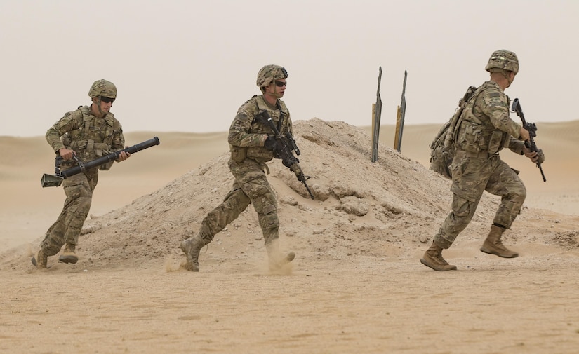 Soldiers with Charger Company, 1st Battalion, 77th Armored Regiment, 3rd Brigade, 1stArmored Division, bound toward the enemy during a squad live-fire exercise Nov. 3, 2016 at Udari Range near Camp Buehring, Kuwait. The four-day training exercise required Soldiers to tactically move as a squad, react to enemy contact, call for indirect fire, assault and clear a bunker and hastily assume defensive positions. (U.S. Army photo by Sgt. Angela Lorden)