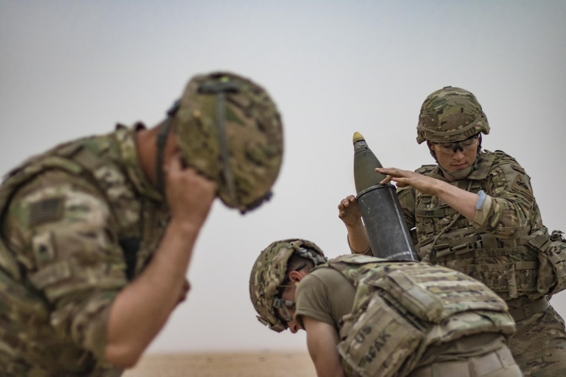 Mortar Soldiers with the 77th Armored Regiment, 3rd Brigade, 1st Armored Division, hang a 120mm mortar round to provide indirect, suppressive fire for infantry Soldiers during a squad live-fire exercise Nov. 3, 2016 at Udari Range near Camp Buehring, Kuwait.  Mortar fire was part of the four-day training exercise synchronized the capabilities of infantry Soldiers, indirect fire infantrymen and forward observers. (U.S. Army photo by Sgt. Angela Lorden)
