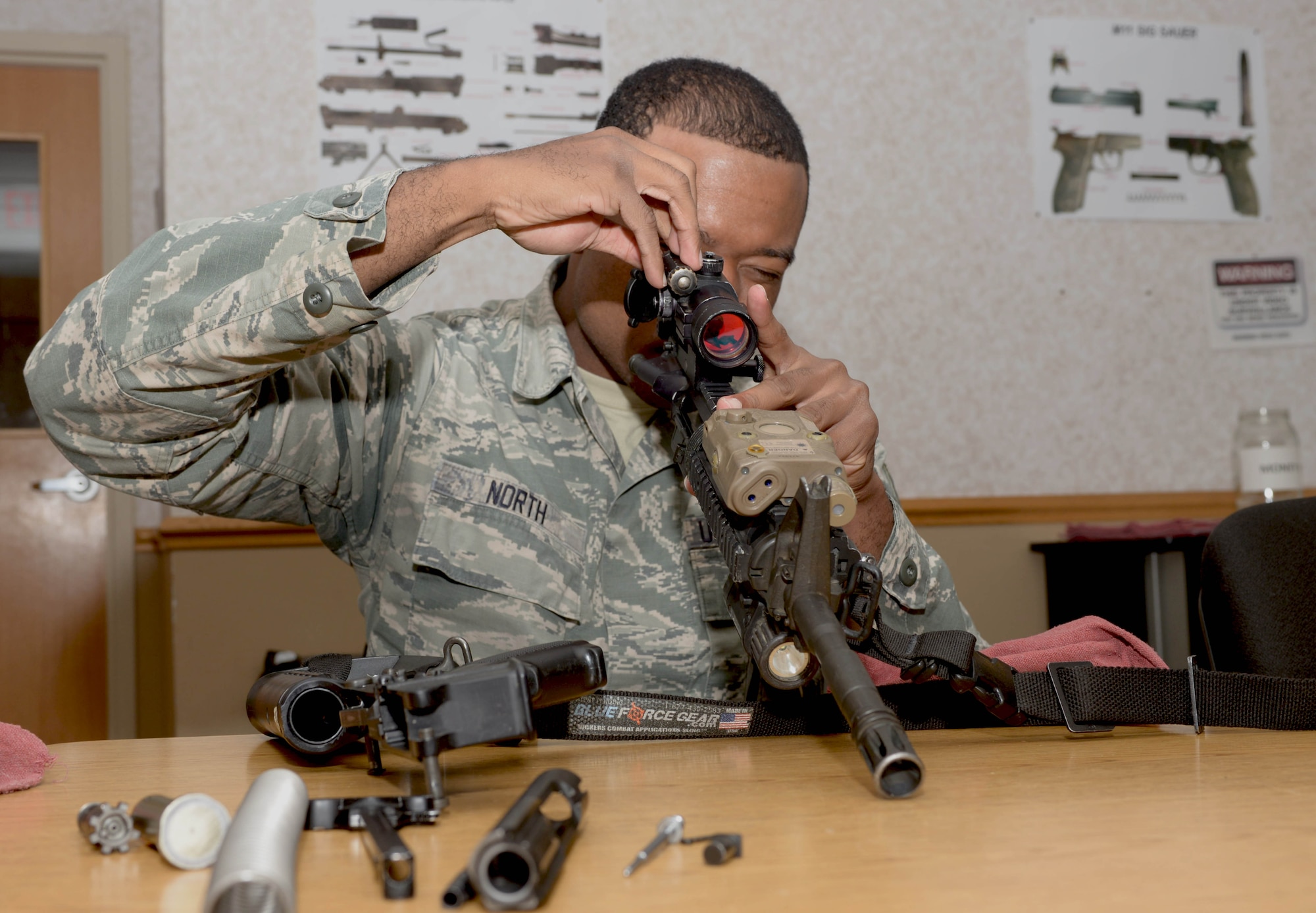 Senior Airman Tijon North, a response force leader assigned to the 28th Security Forces Squadron, assembles an M4 carbine rifle during a training session at Ellsworth Air Force Base, S.D., Oct. 6, 2016. The mission of Combat Arms Training and Maintenance is to insure that anyone who needs to arm with lethal weapons are qualified and know the operations and proper procedures of the equipment they are using. (U.S. Air Force photo by Airman 1st Class Donald C. Knechtel)