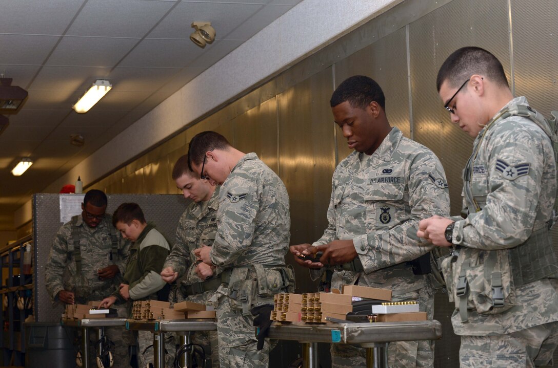 Airmen assigned to the 28th Security Forces Squadron load M9 magazines at the Combat Arms Training and Maintenance firing range at Ellsworth Air Force Base, S.D., Oct. 6, 2016. Airmen regularly train at CATM to ensure their weapons qualification records are accurate and up-to-date. (U.S. Air Force photo by Airman 1st Class Donald C. Knechtel)

